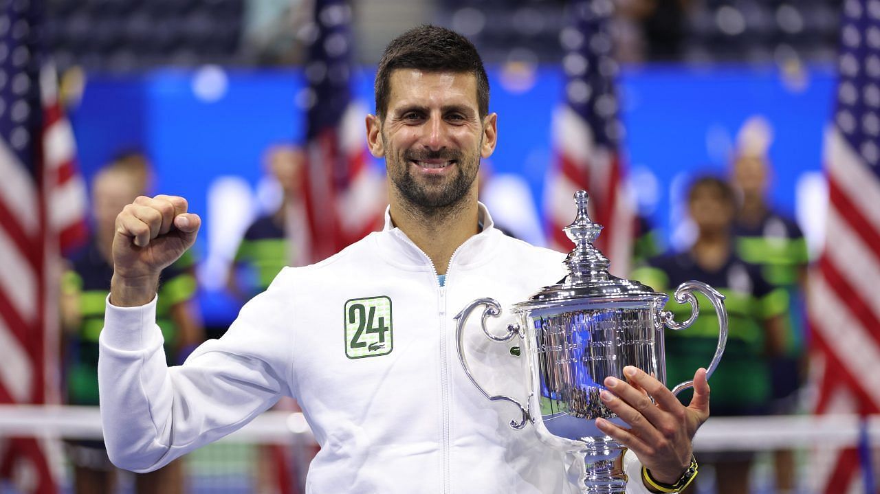 Novak Djokovic poses with the 2023 US Open trophy