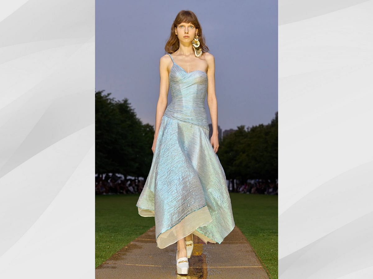 Pleated One-Shoulder Metallic Blue Dress (Image via getty)