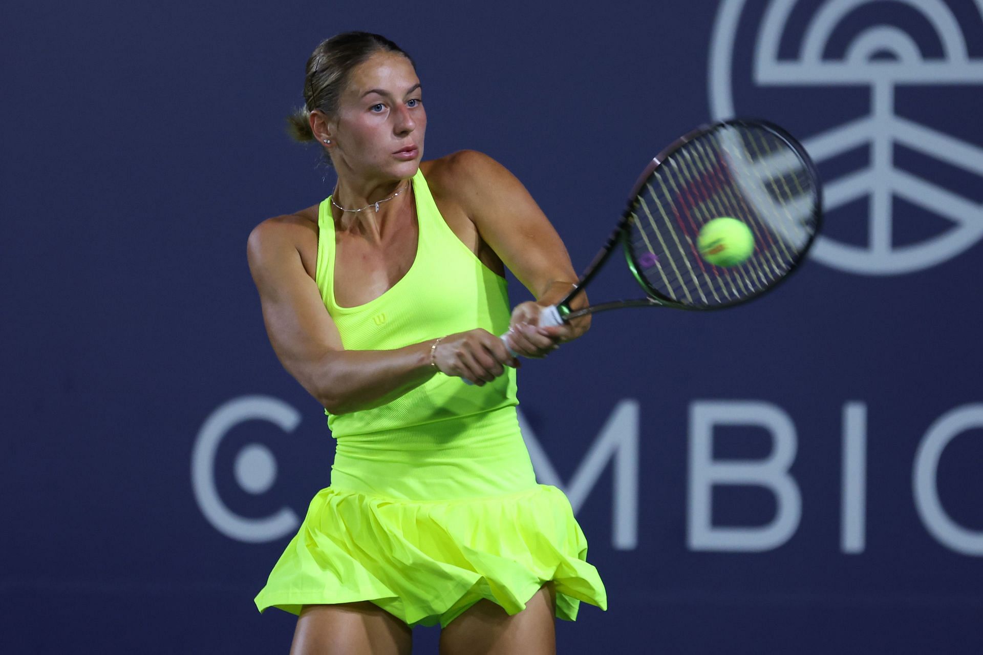Marta Kostyuk strikes the ball at the San Diego Open