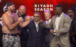 WATCH: Tyson Fury tries his best to get Francis Ngannou take his shirt off at pre-fight presser faceoff