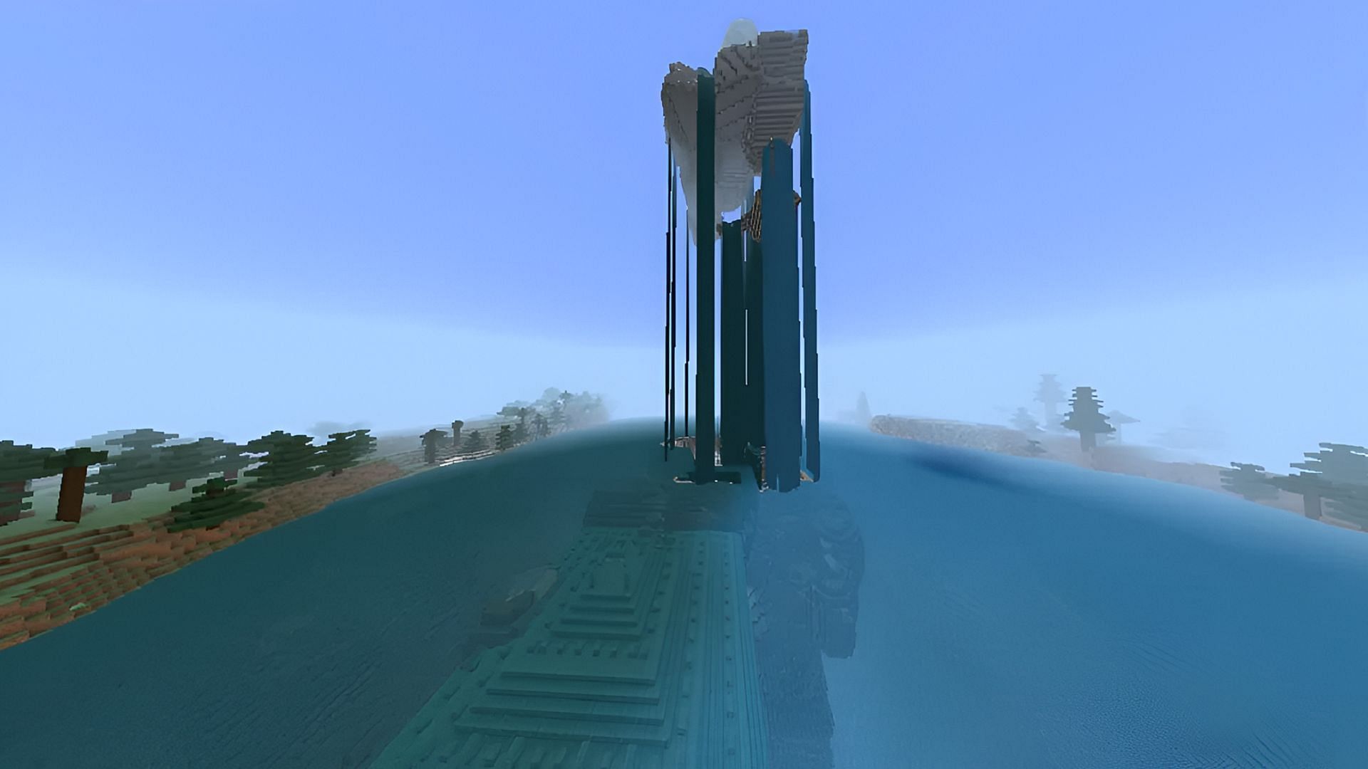A floating waterfall island residing over an ocean monument in Minecraft.