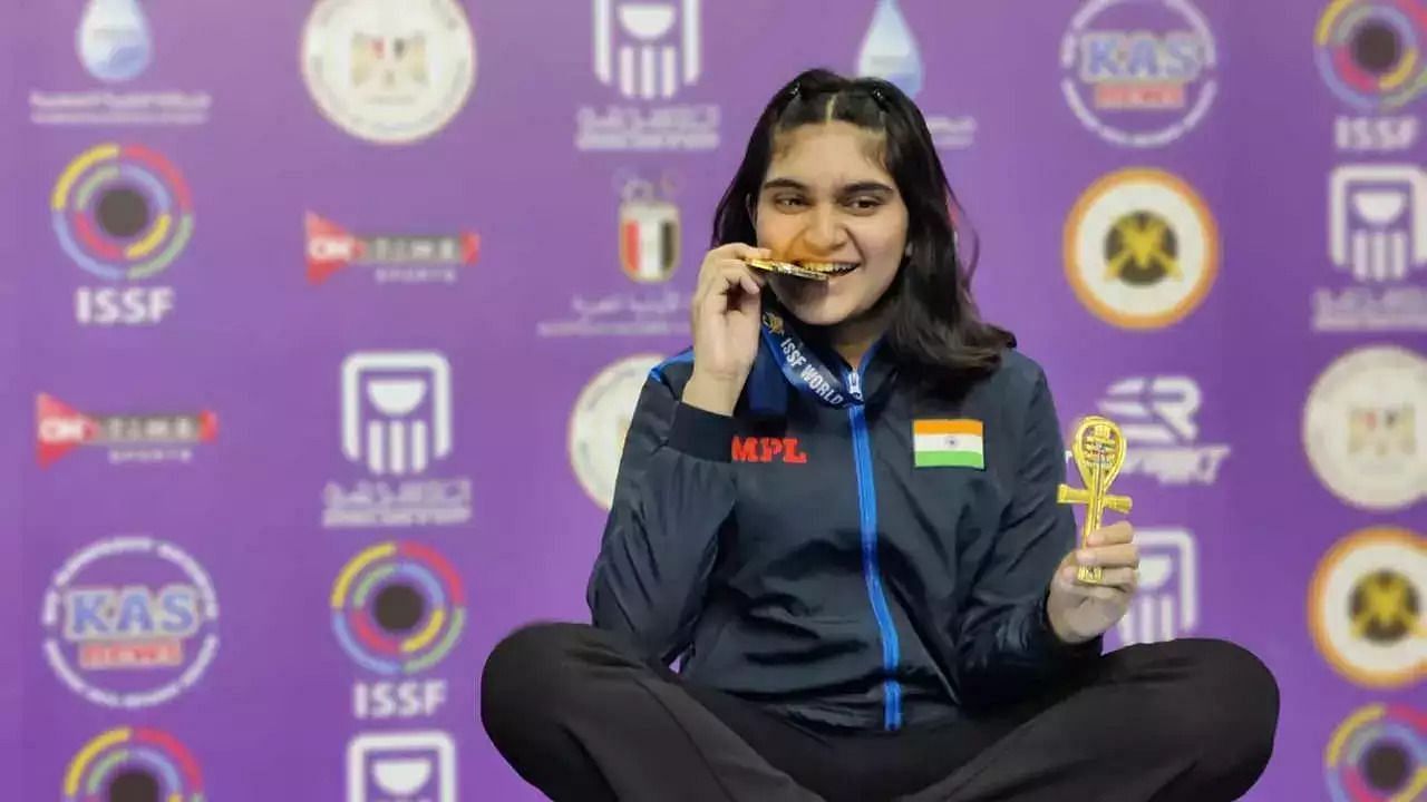 Esha Singh posing with her medals.