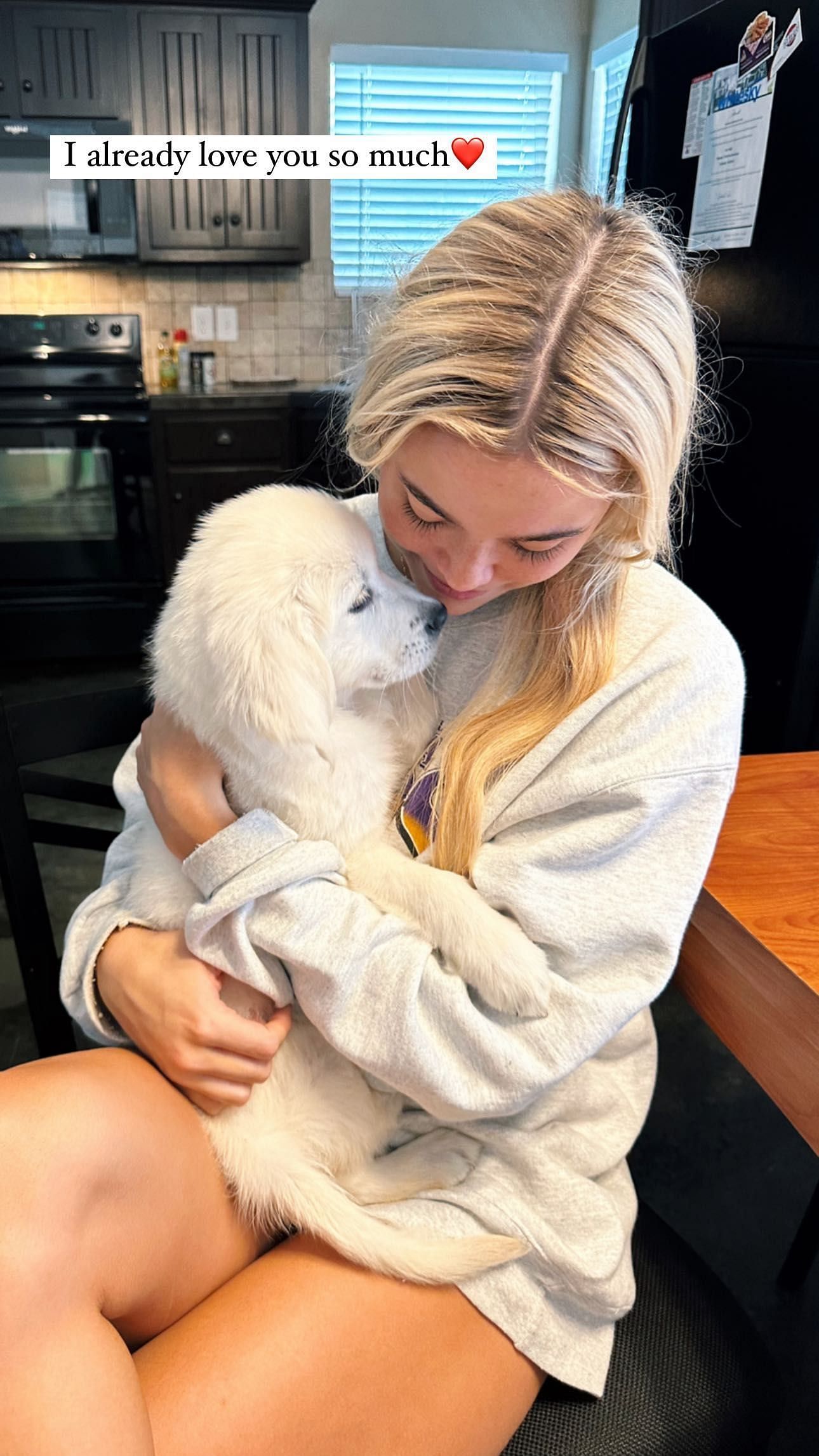 Olivia Dunne with her new puppy.