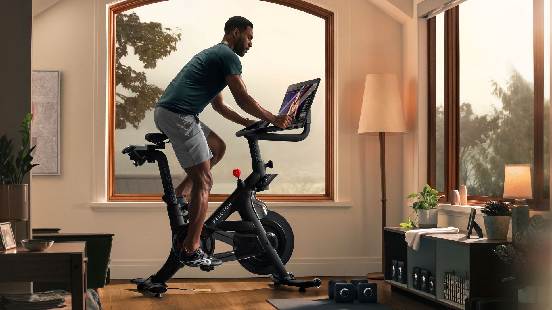 Details explored about Peloton as the bike company is being sued by a New York mother who claimed that her son died while exercising on the bike. (Image via Peloton)