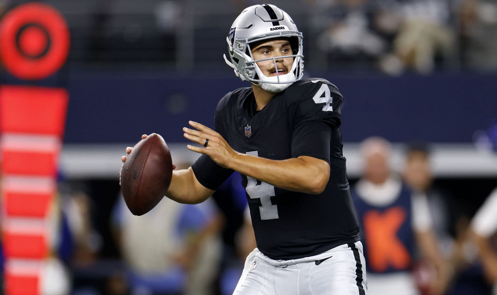 Las Vegas Raiders quarterback Aidan O'Connell (4) gestures as he