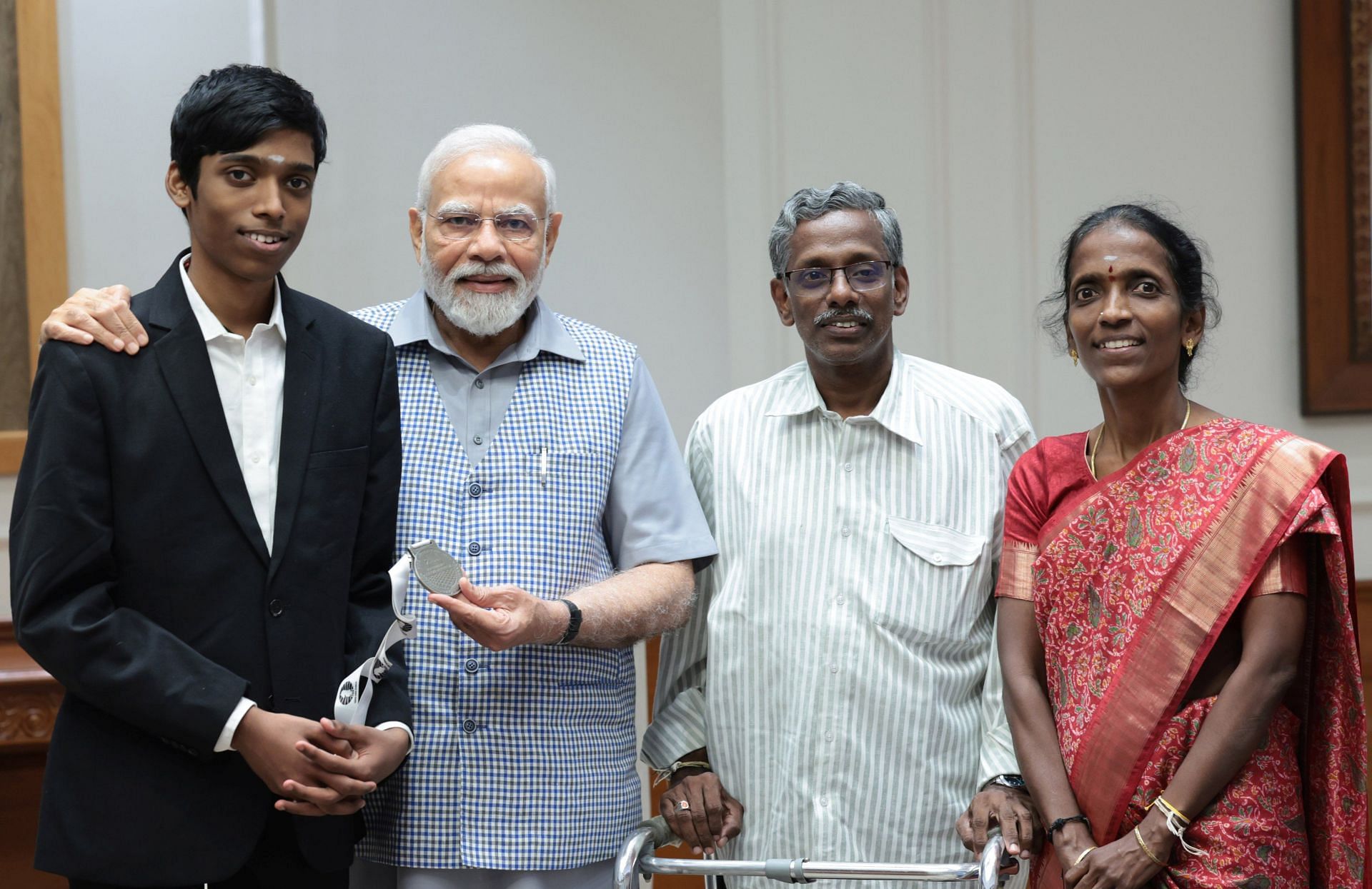 Praggnanandhaa of India with PM Narendra Modi. Courtesy: Praggnanandhaa