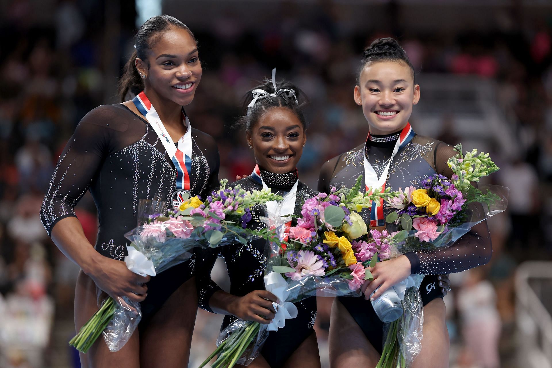 Shilese Jones, Simone Biles, and Leanne Wong pose for a photo during the 2023 U.S. Gymnastics Championships in San Jose, California