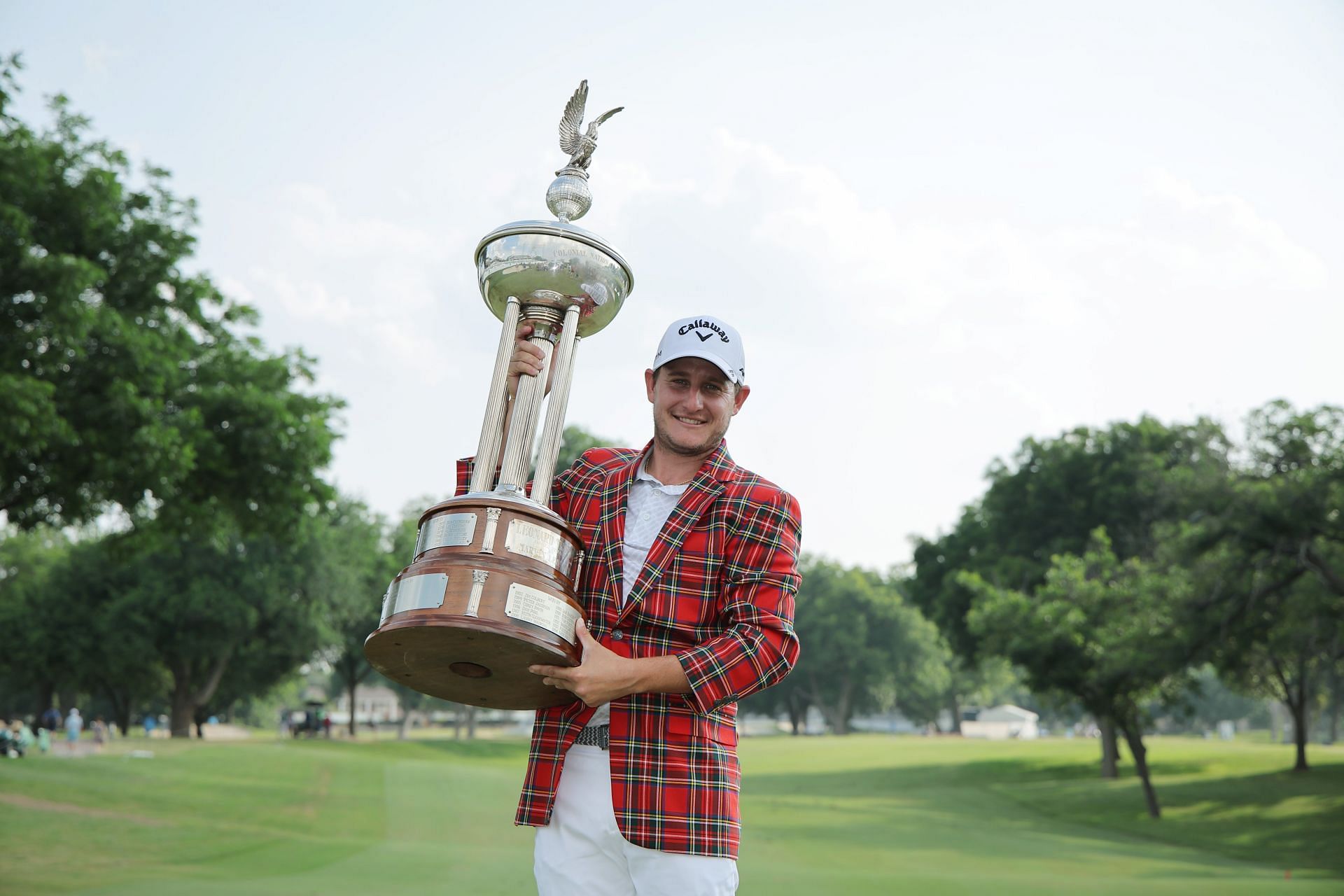 Emiliano Grillo of Argentina poses with the trophy after winning the Charles Schwab Challenge (Image via Getty)