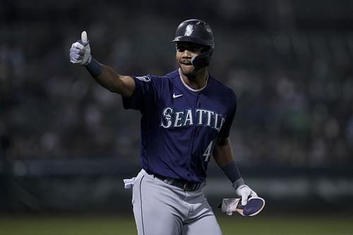 Julio Rodríguez gestures toward the dugout during a baseball game in Oakland, CA