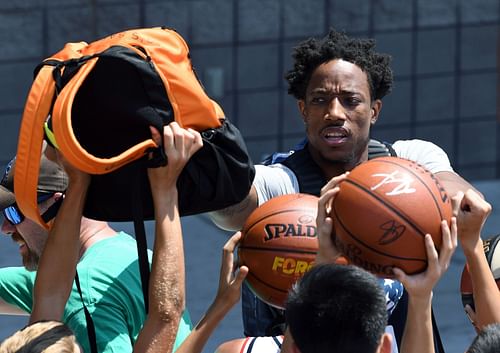 DeMar DeRozan signing autographs for fans back in 2018