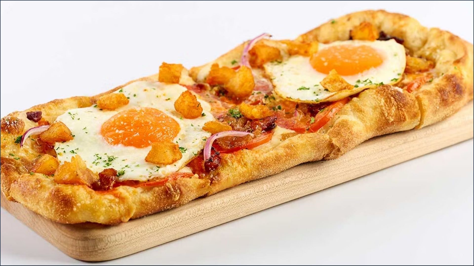 The new Brunch Flatbread can be availed for over $14.95 every Saturday and Sunday (Image via The Cheesecake Factory)