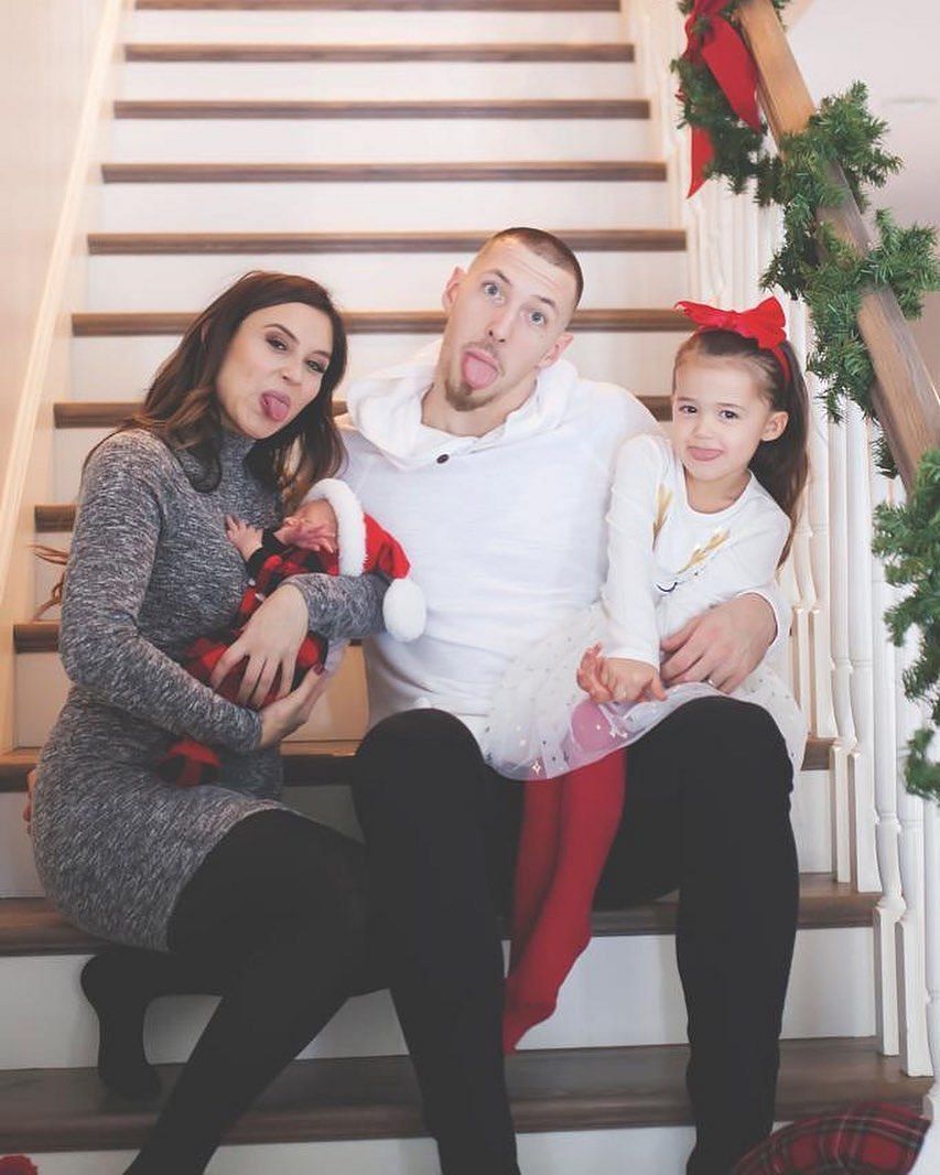 Daniel Theis and Lena Theis with their children