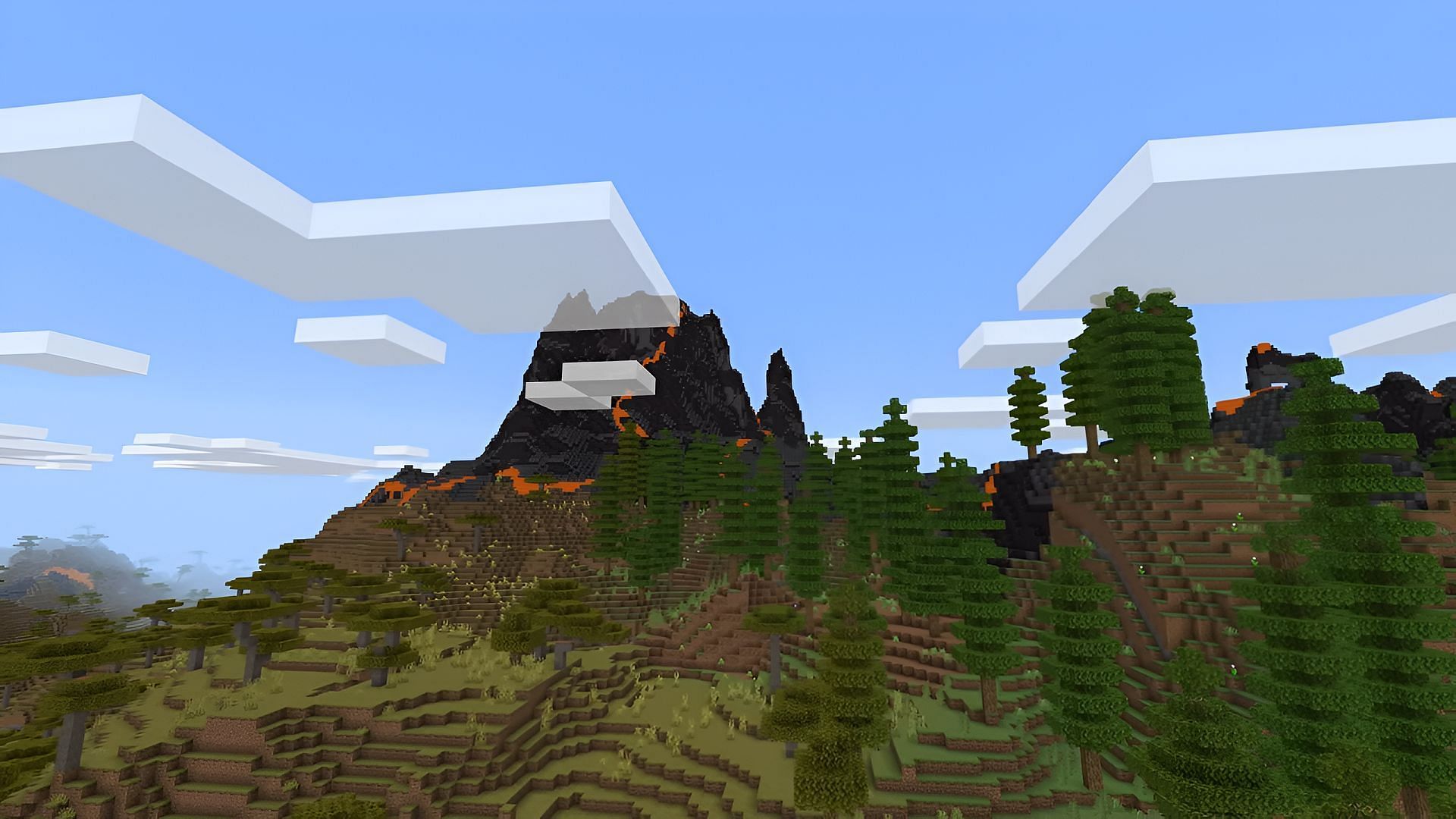 Volcanic peaks generating on a mountain in the Expansive Biomes add-on (Image via iKorbon/YouTube)