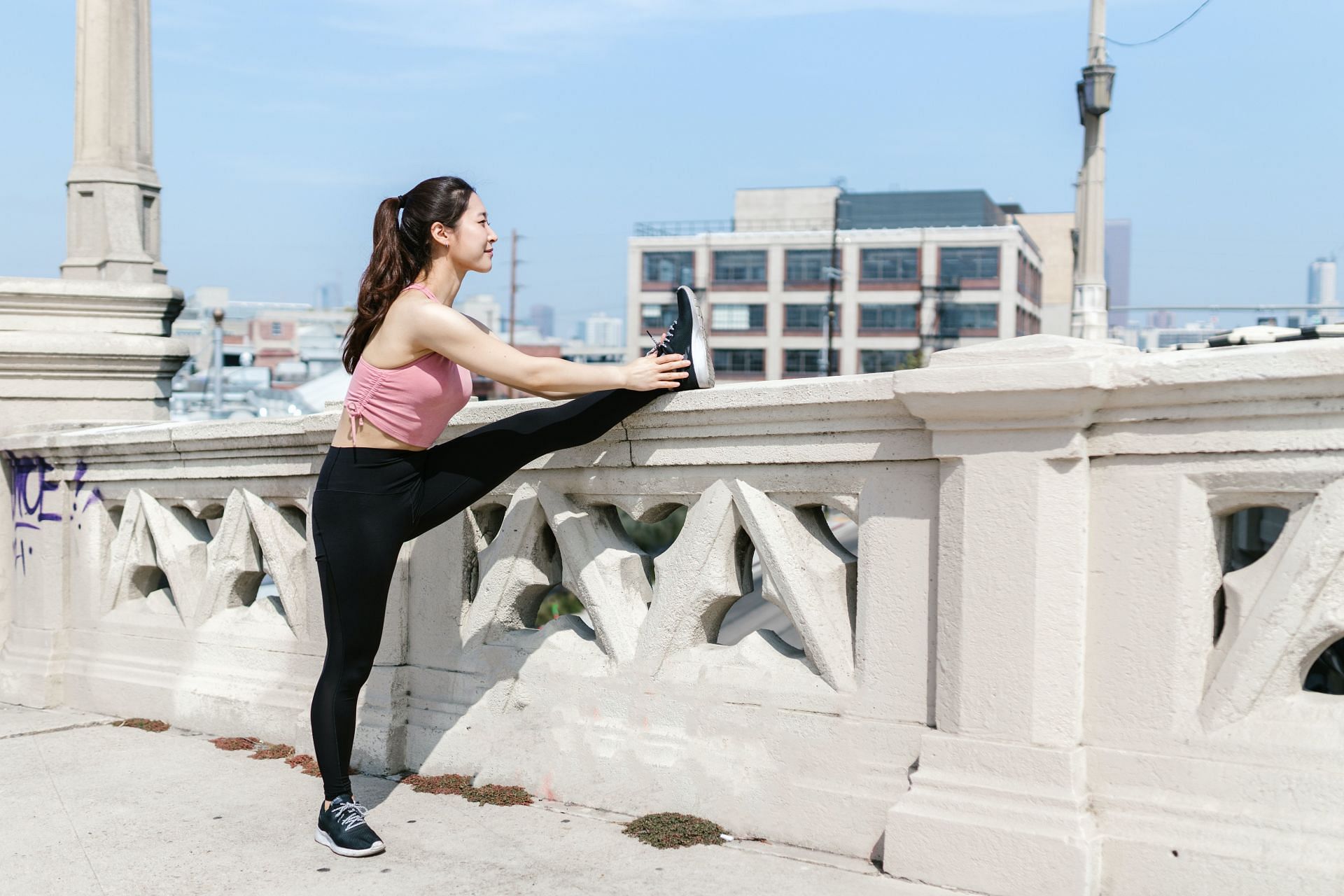 A stretching routine helps ease muscle discomfort. (Image via Pexels/ RDNE Stock Project)