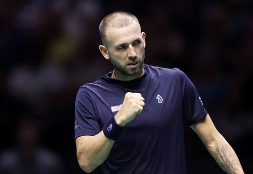 Daniel Evans celebrates after defeating Arthur Fils in a 2023 Davis Cup match.