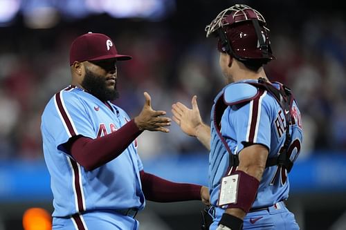 Jose Alvarado, left, and J.T. Realmuto celebrate after a win against the New York Mets