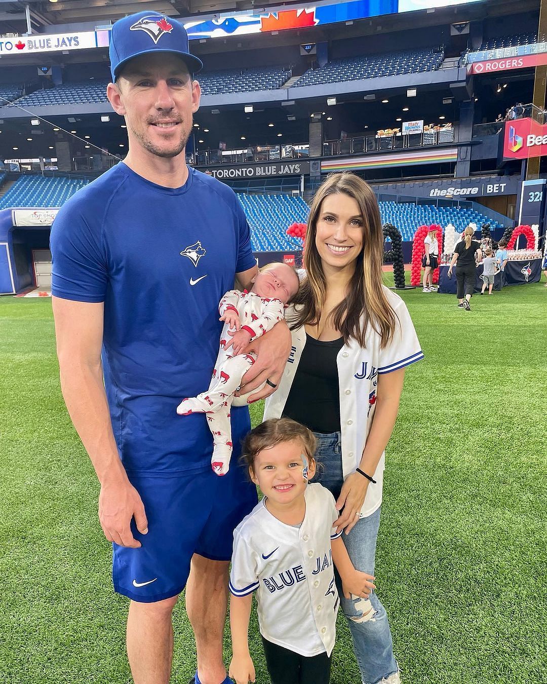 Chris Bassitt and Jessica Bassitt with their children