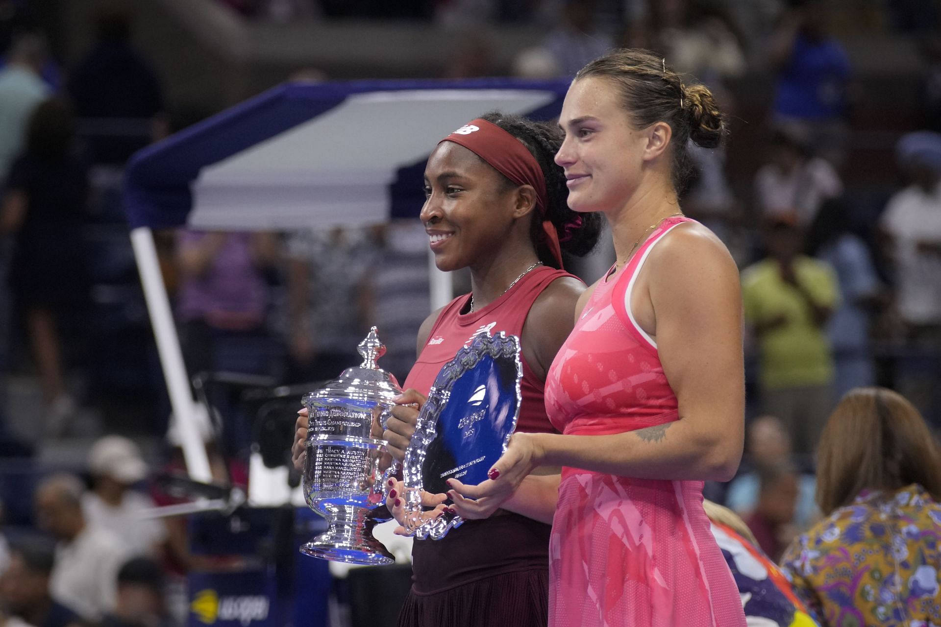 Coco Gauff and Aryna Sabalenka pictured with their US Open trophies.