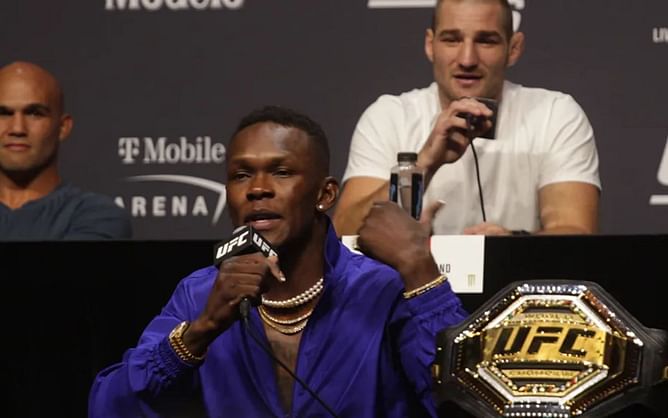 "I just got him his first passport" - Israel Adesanya gives toungue-in-cheek response to Sean Strickland's attacks on Chinese gig