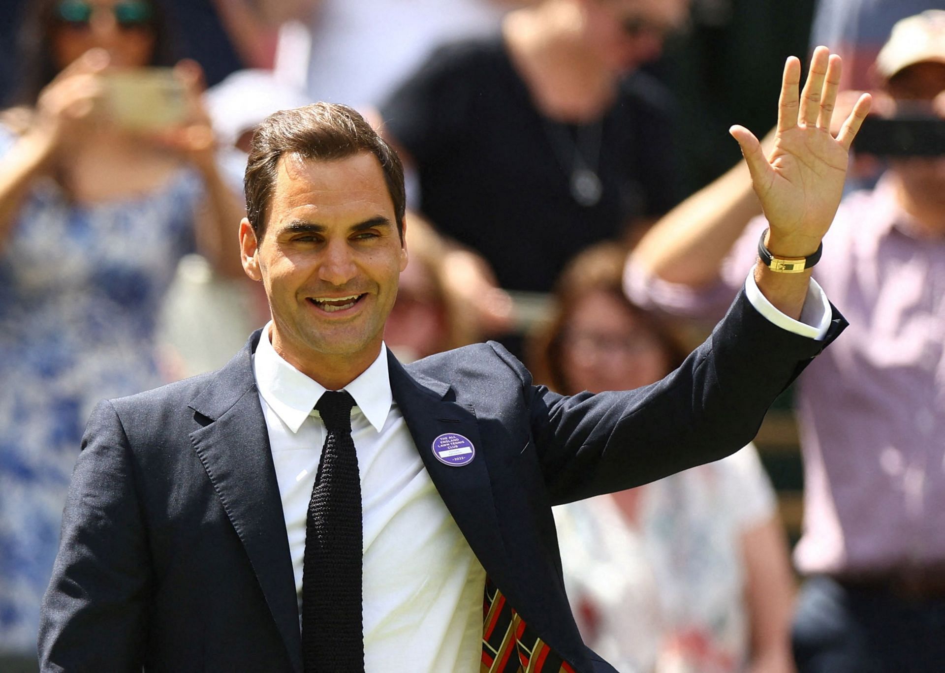 Roger Federer waves to his fans during an appearance at 2022 Wimbledon