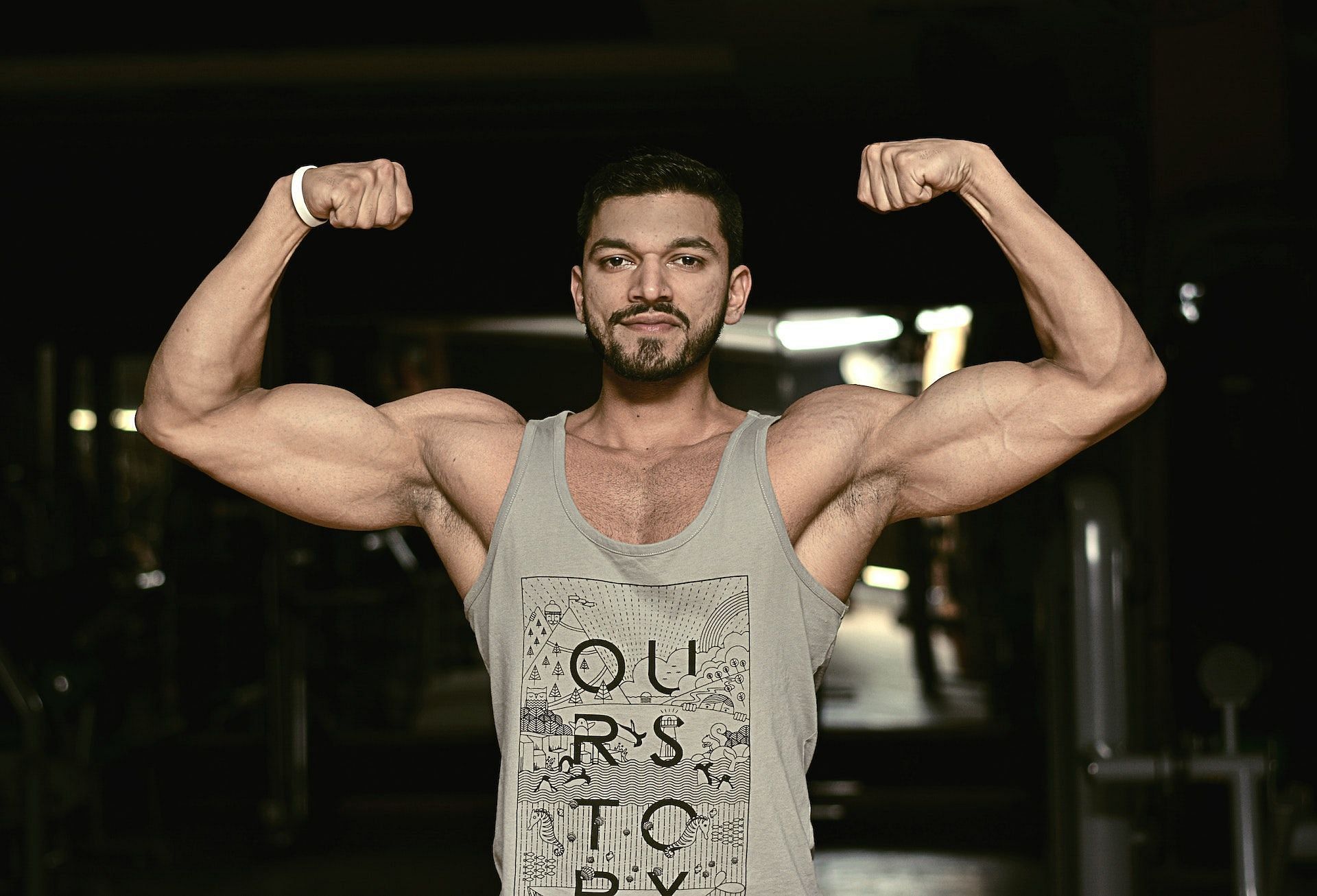 EZ bar preacher curl targets the biceps. (Photo via Pexels/mahmood sufiyan)