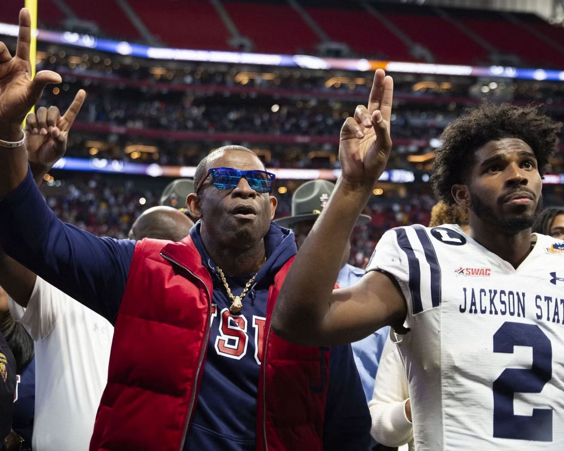Deion Sanders and his son Shedeur Sanders after a Jackson State game