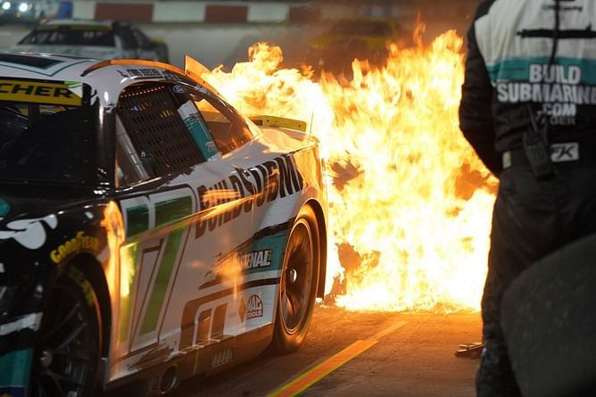 WATCH: Chris Buescher and RFK Racing’s fiery pit stop as rear tire changer does not flinch despite flames erupting from the car’s rear end