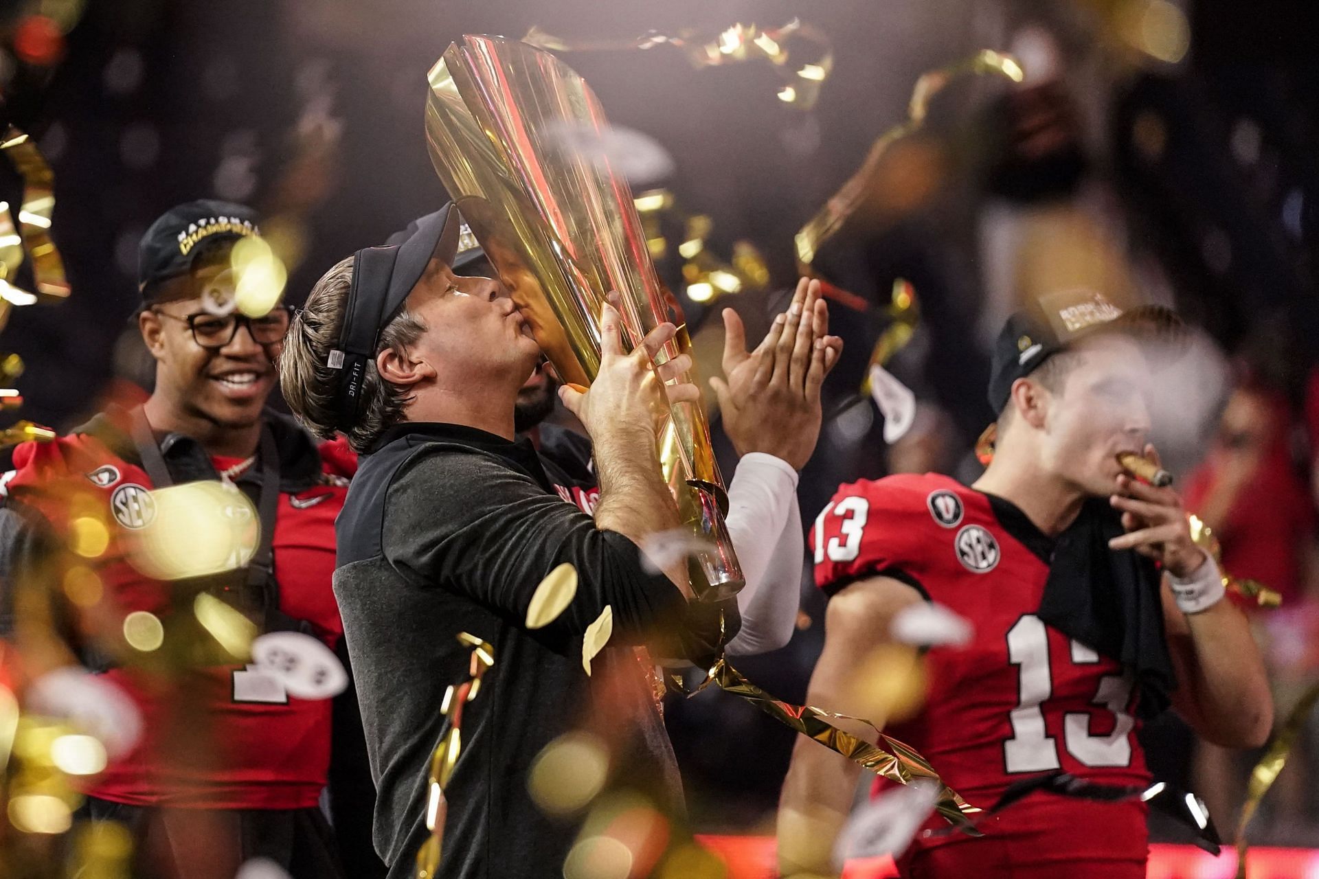 Kirby Smart kisses the trophy after Georgia beat TCU