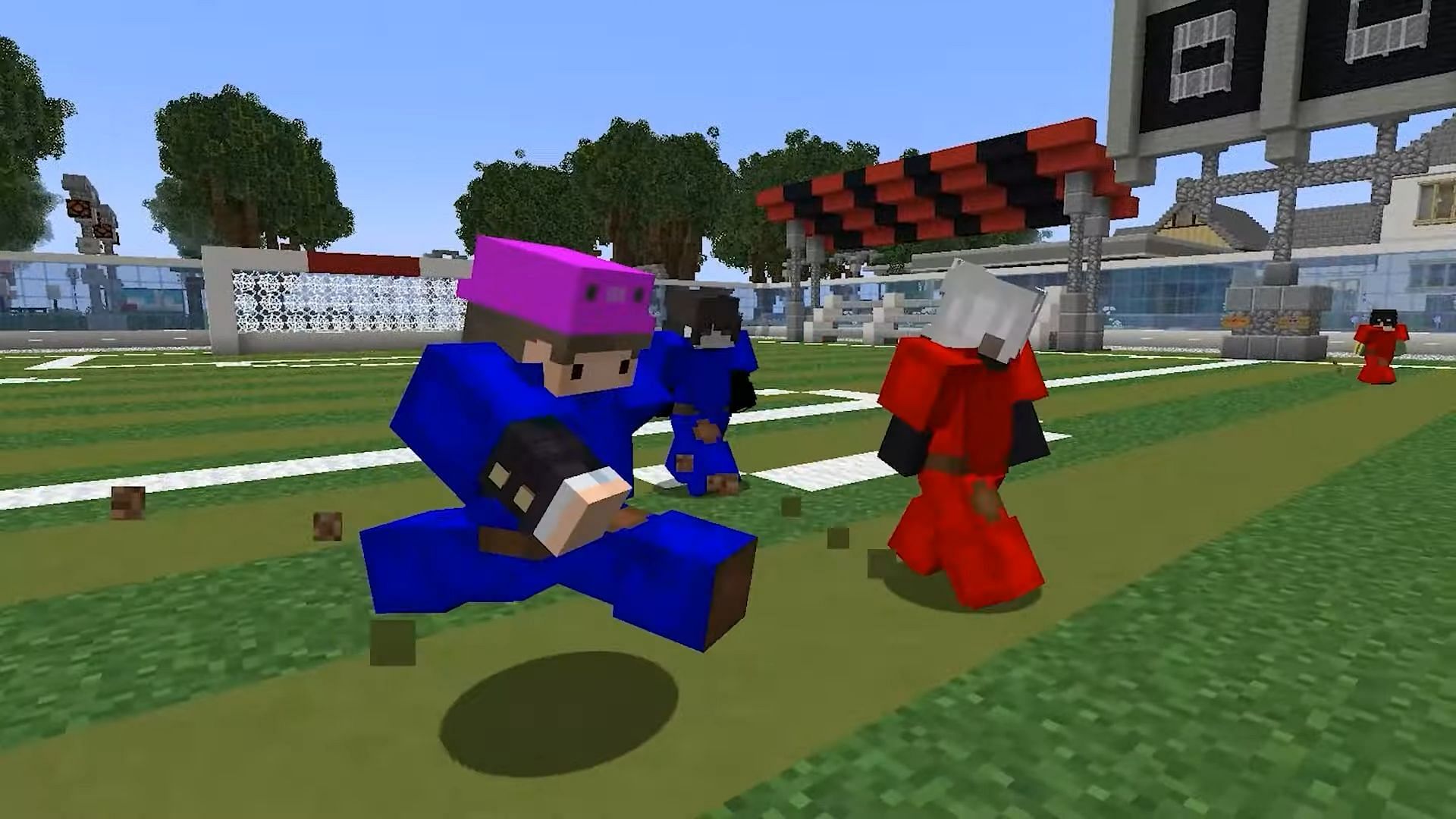 Players compete on a football pitch in a Minecraft roleplay server.
