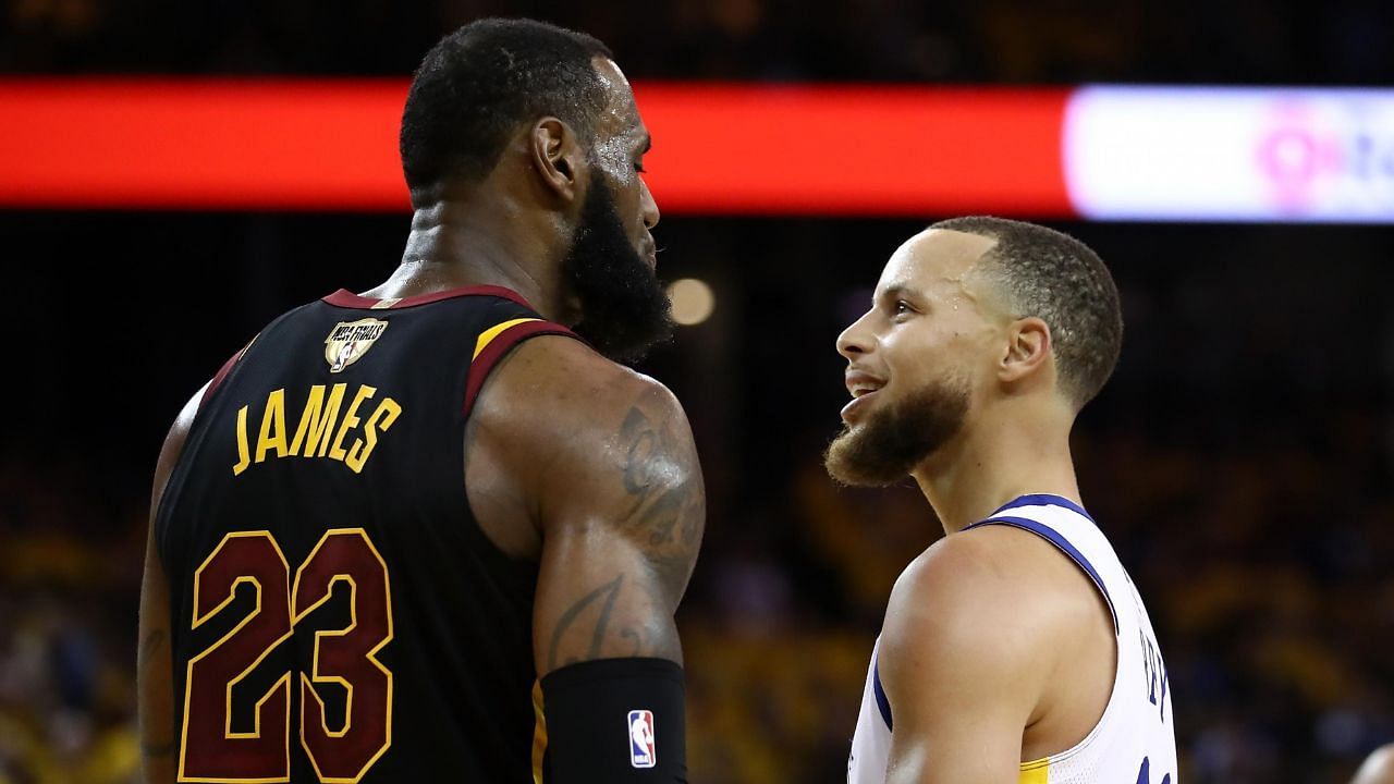 LeBron James staring down Steph Curry.