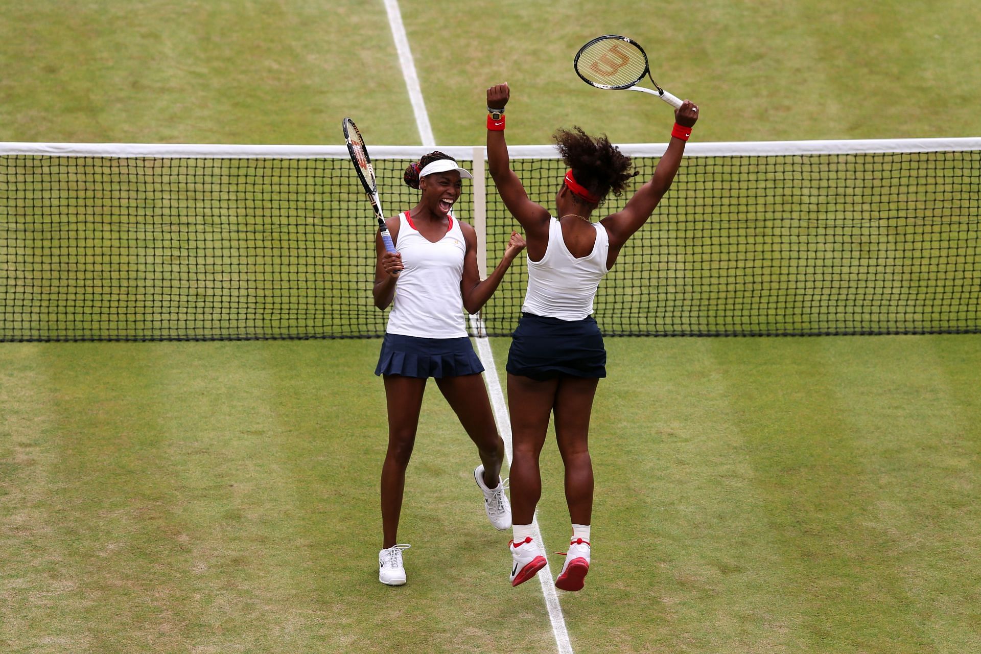 Serena Williams and Venus Williams celebrate 2012 Women's Doubles victory