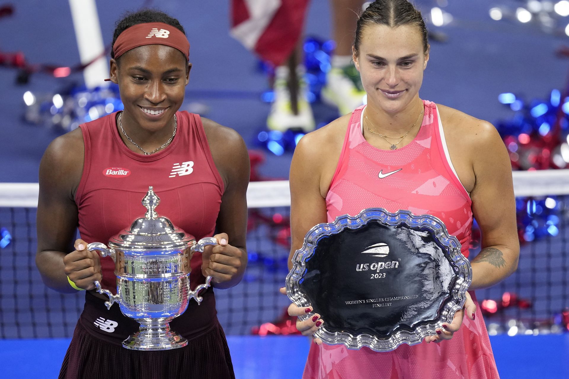 Aryna Sabalenka pictured with her US Open trophy alongside Coco Gauff