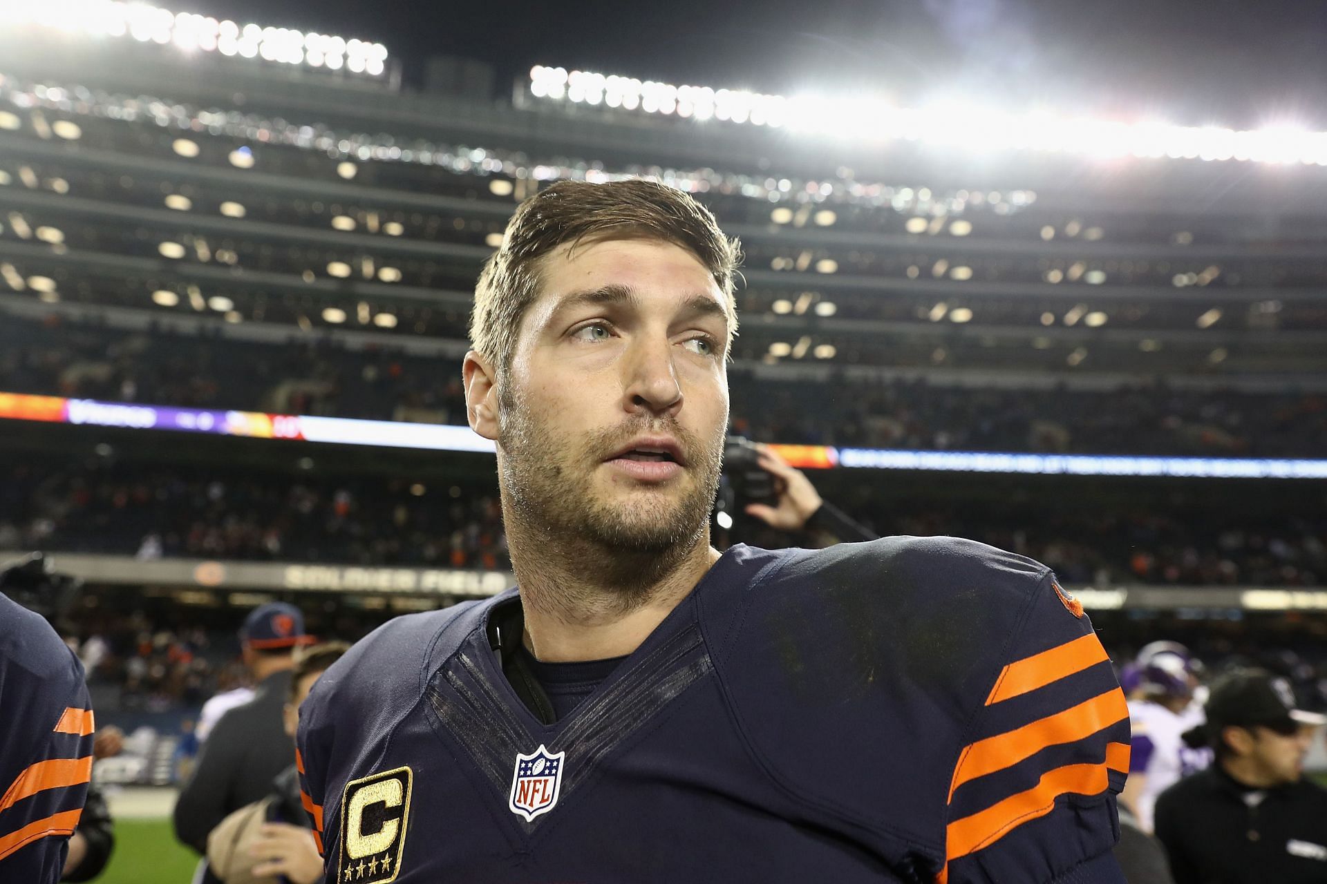 Denver Broncos quarterback Jay Cutler warms up at Invesco Field at