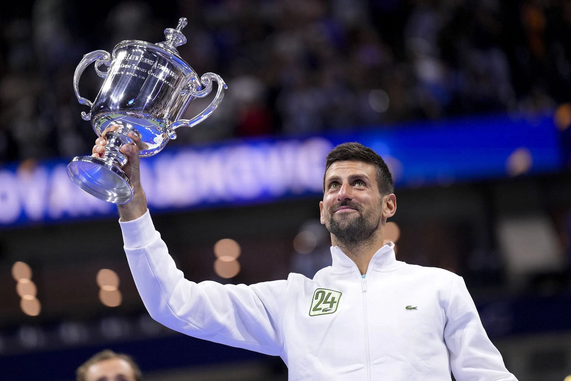 The Serb lifts the US Open trophy.