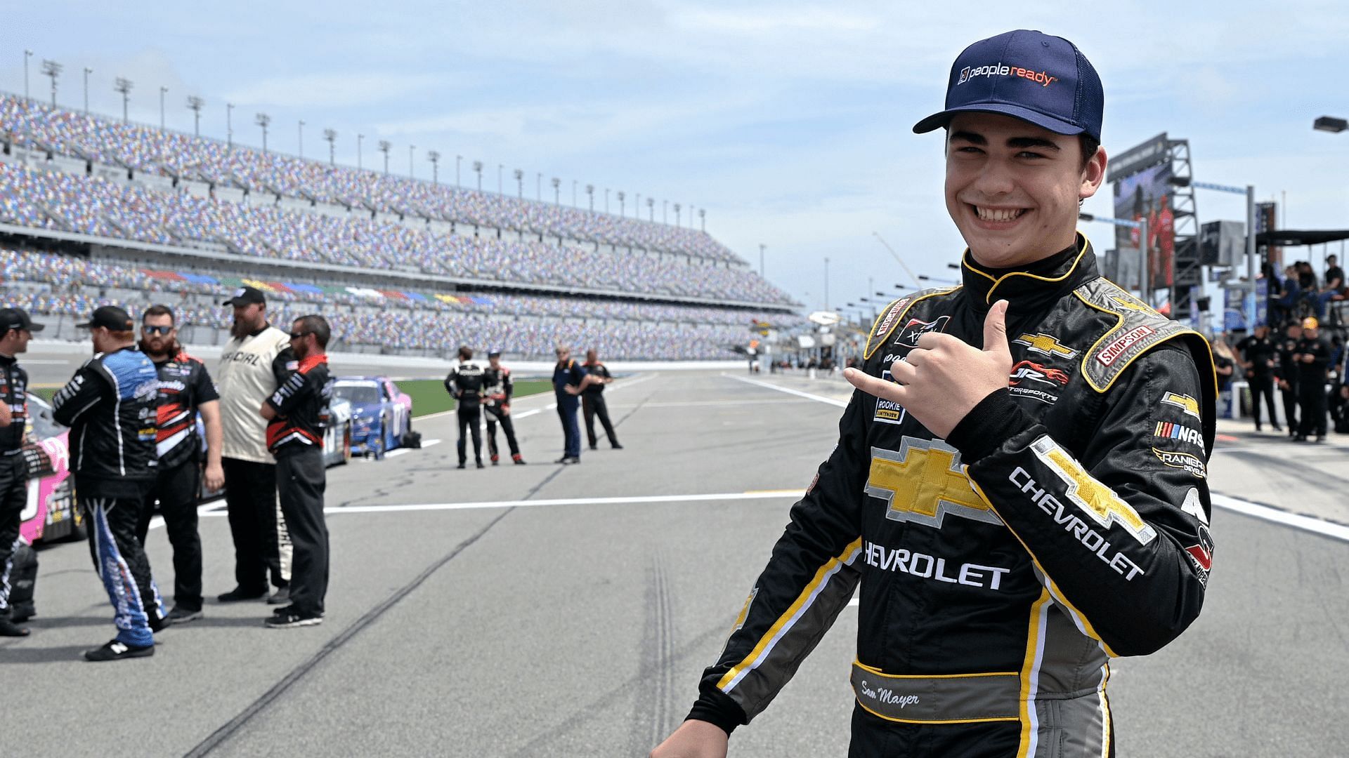 Driver Sam Mayer walks to his vehicle on pit road before a NASCAR Xfinity Series auto race at Daytona International Speedway, Saturday, Aug. 28, 2021, in Daytona Beach, Fla. (AP Photo/Phelan M. Ebenhack)