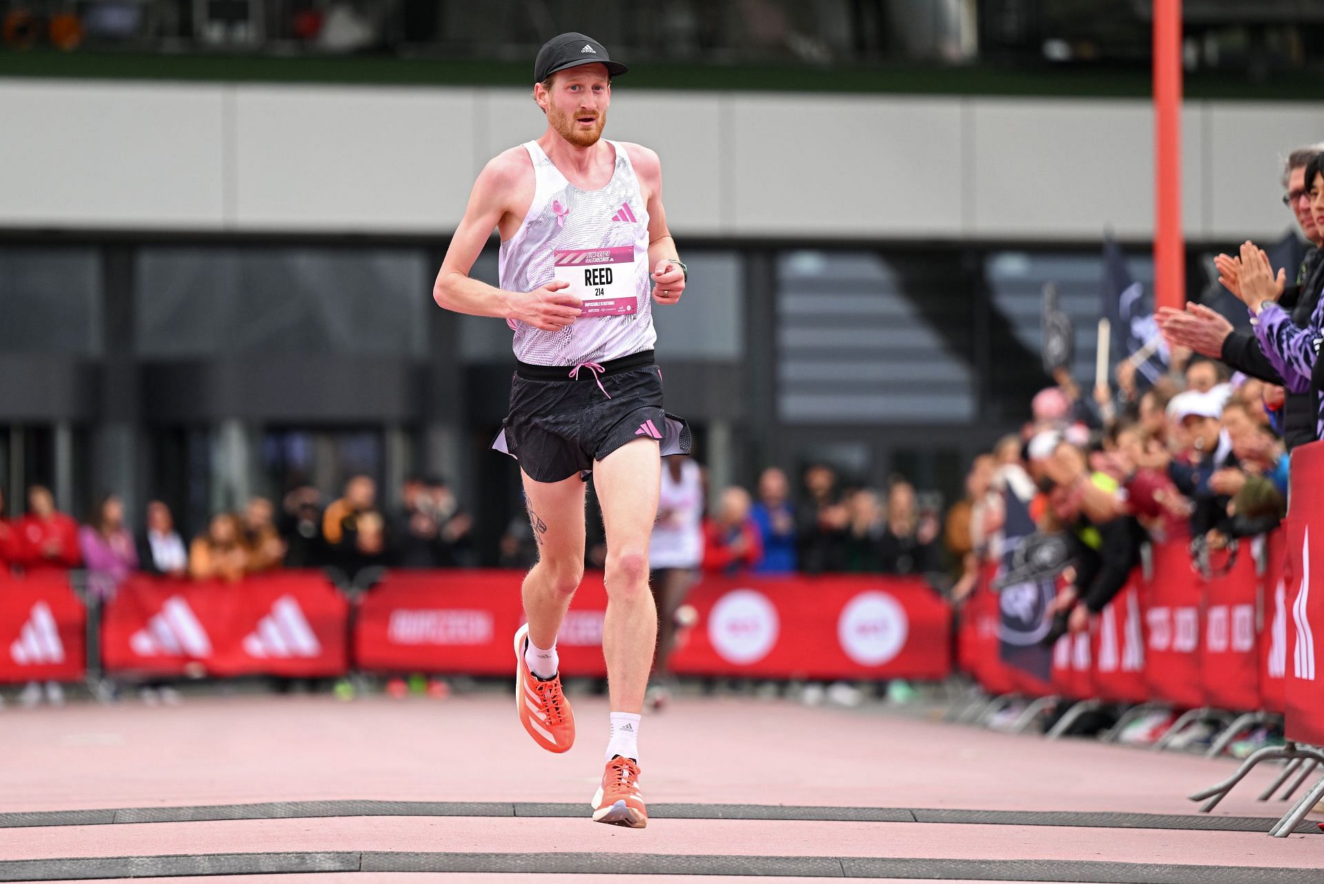 Reed Fischer at the finish line in the Men&#039;s 21.1 Km race at the 2023 Adizero: Road To Records in Herzogenaurach, Germany