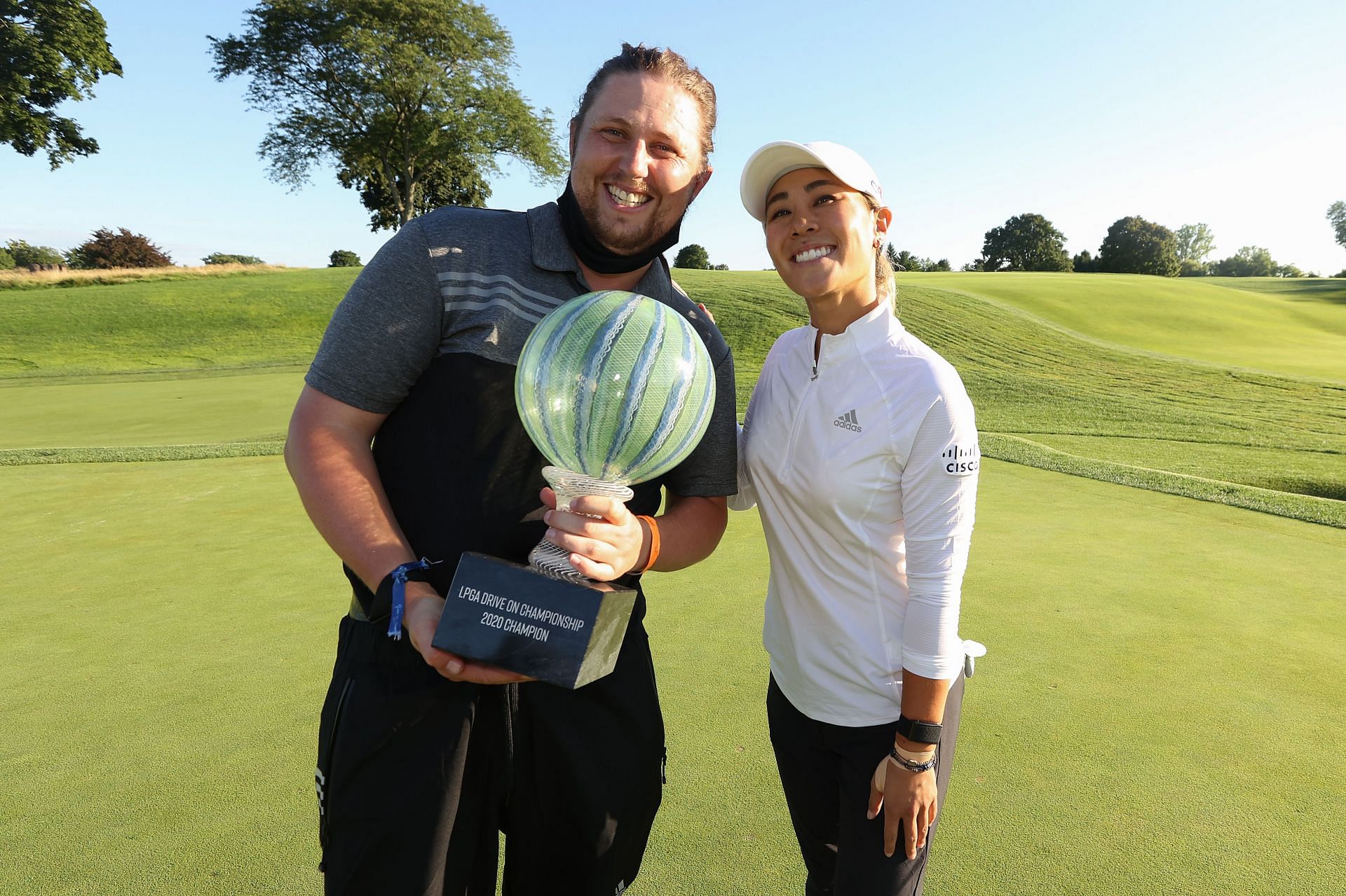 Danielle Kang celebrates with her caddie, Oliver Brett, after her -7 under par final round victory in the LPGA Drive On Championship (Image via Getty)