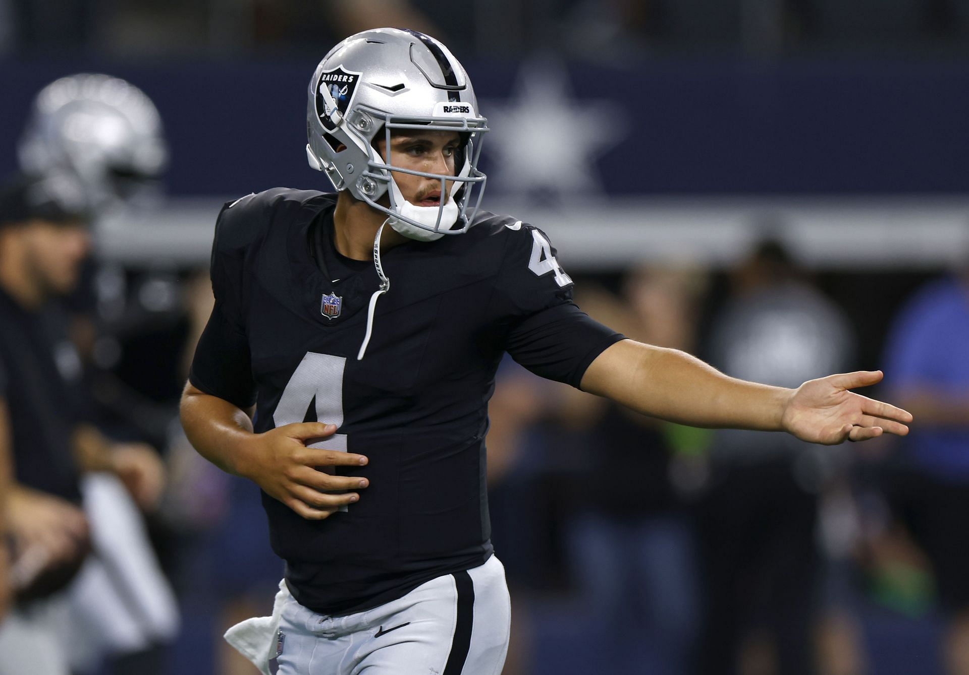 Photo: Raiders Quarterback Aiden O'Connell is Pushed into the