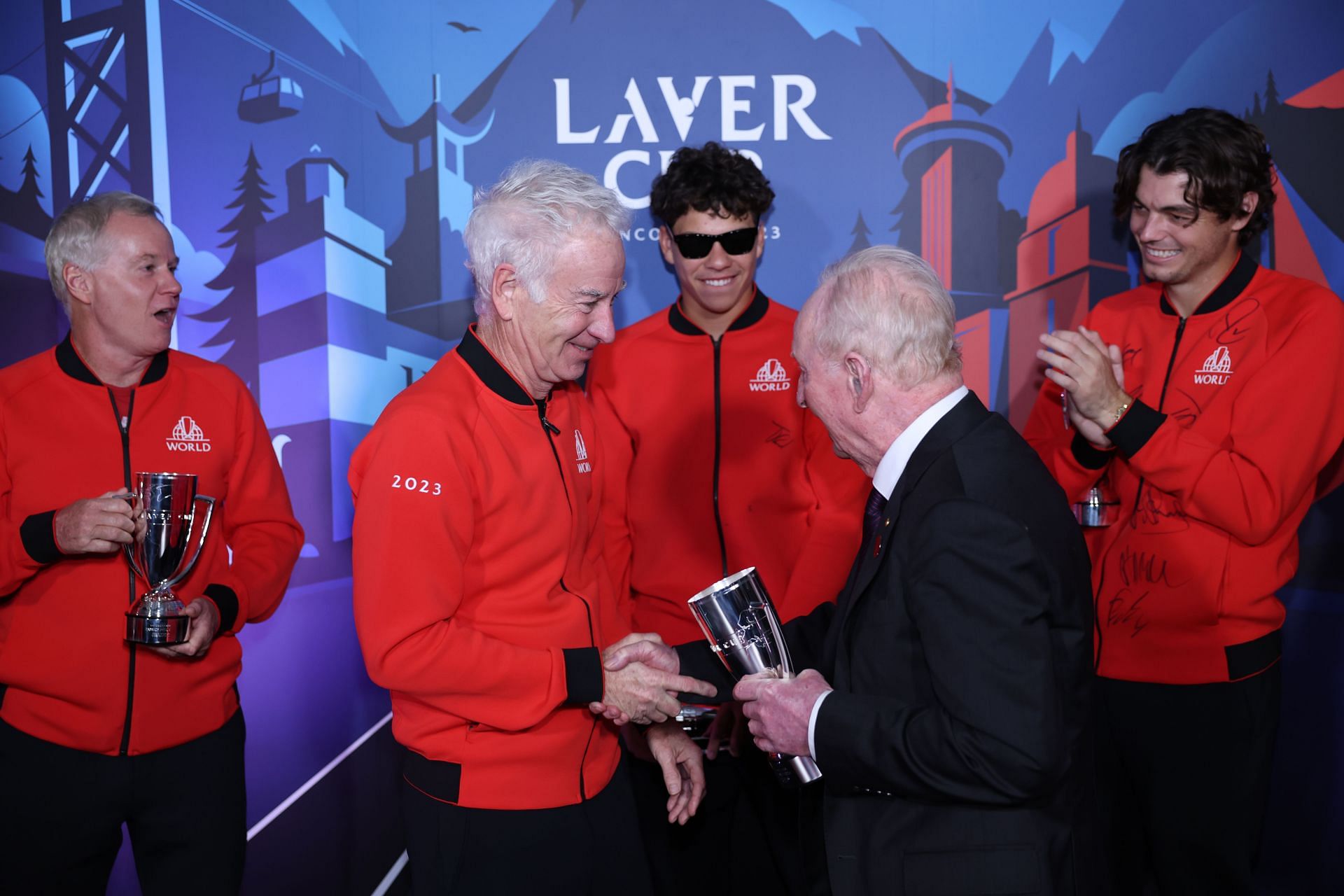 John McEnroe and the Team World players with Rod Laver
