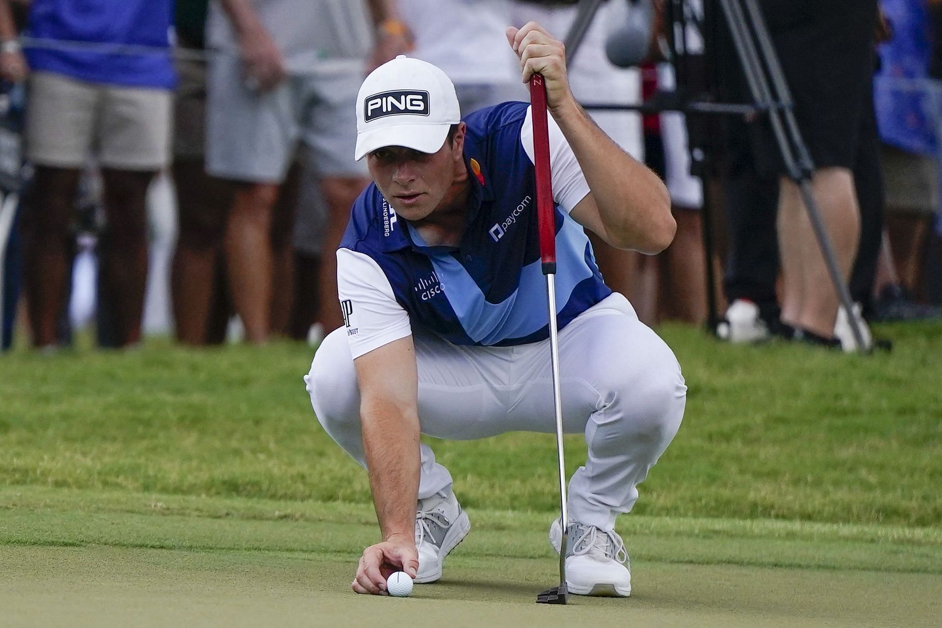 Viktor Hovland, of Norway, lines up a putt on the first green during the third round of the Tour Championship (Image via Getty)