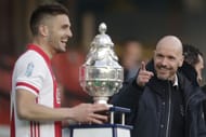 Ajax's Dusan Tadic (left) celebrates the team's KNVB Cup win as Ten Hag (right) looks on.