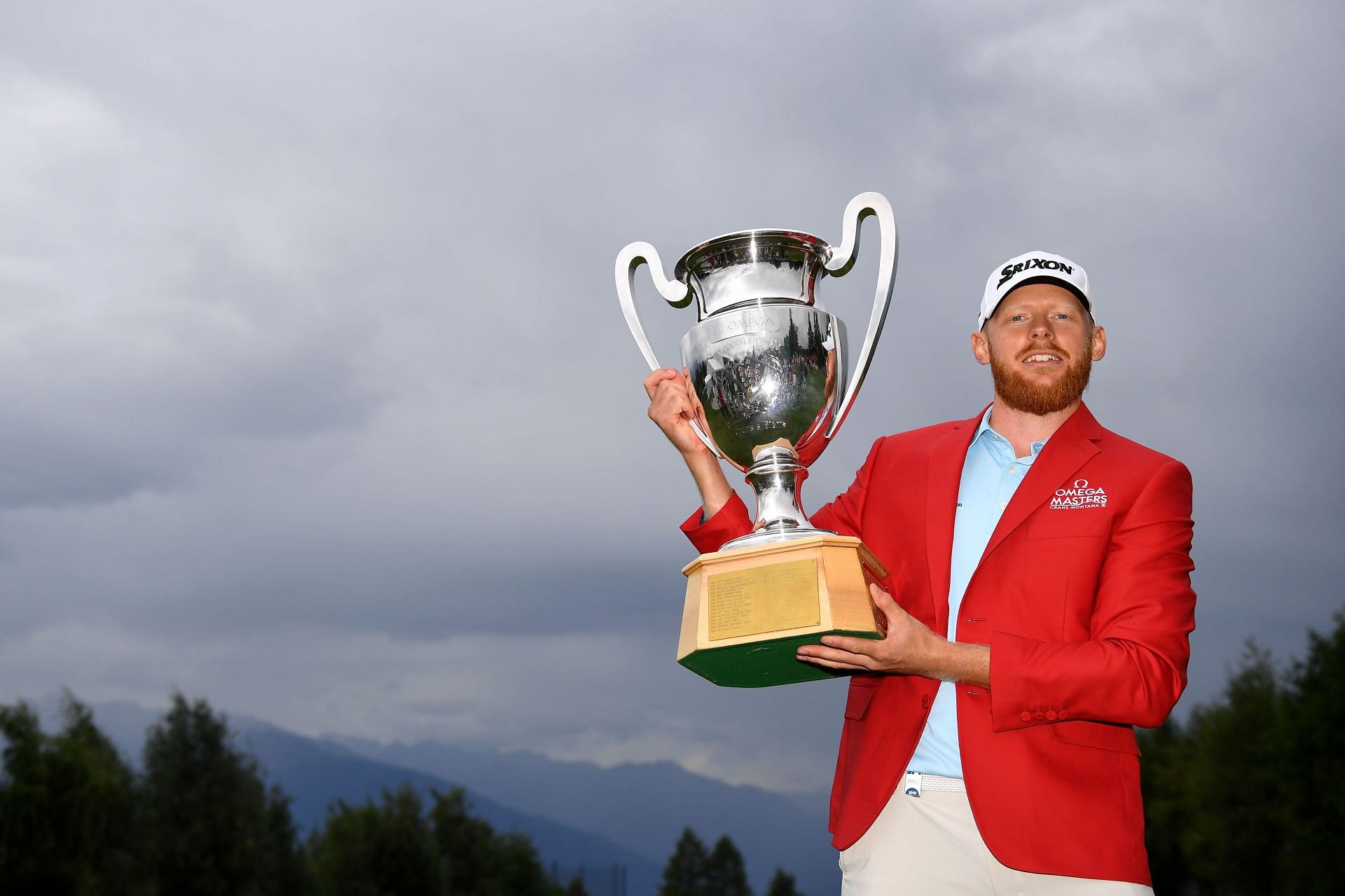 Sebastian S&ouml;derberg with the trophy following his victory in the playoff during Day Four of the Omega European Masters 2019