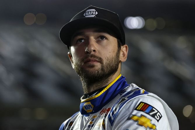 WATCH: Young Chase Elliott fan refuses to accept Chris Buescher's hat in wholesome driver-fan exchange