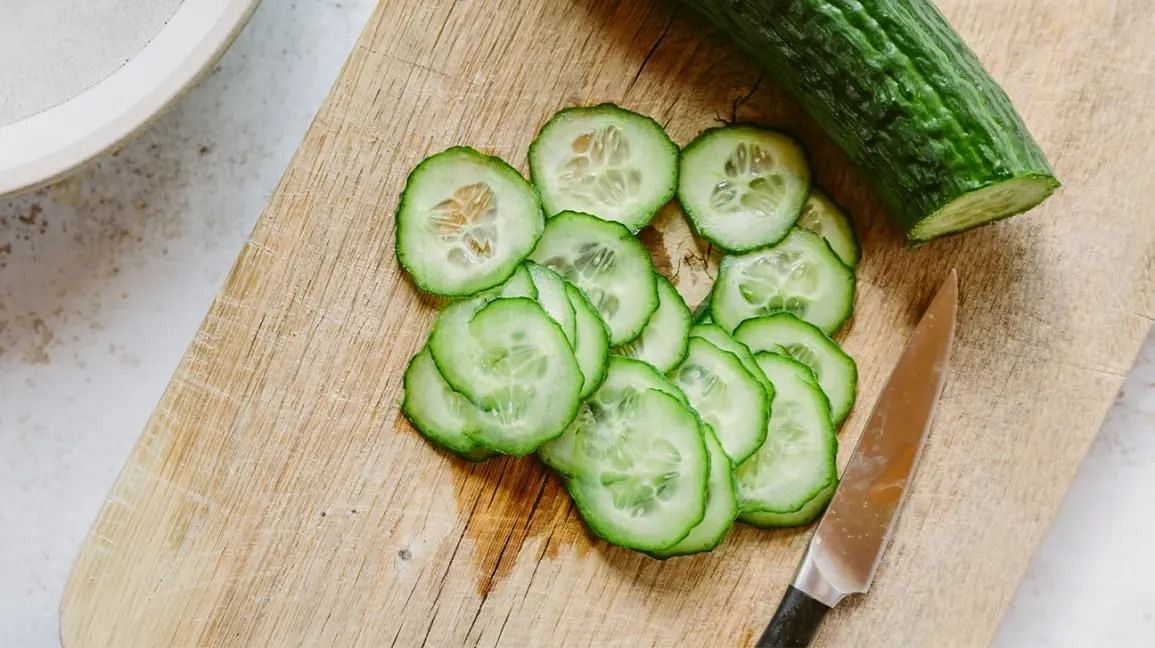 Eating cucumber at night (Image via Getty Images)