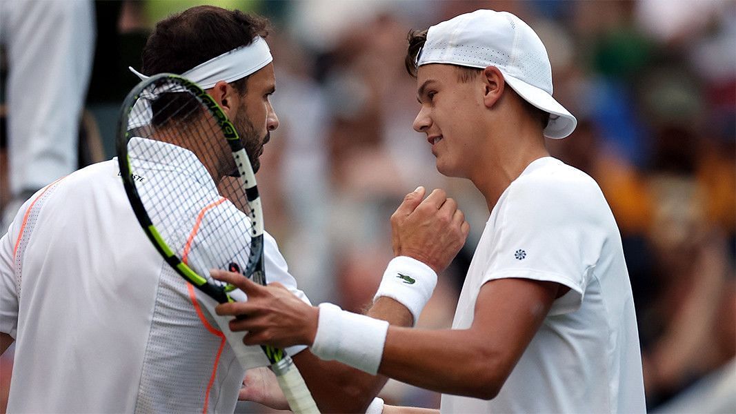 Holger Rune and Grigor Dimitrov greet each other after their Wimbledon encounter