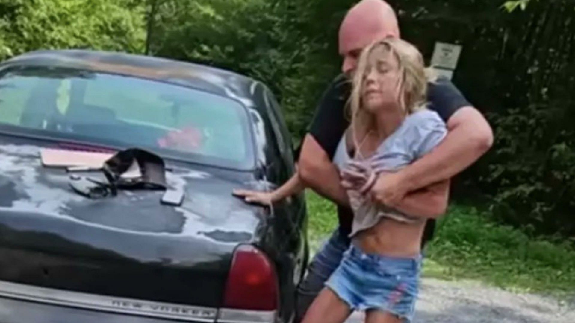 Ronald Davis violently restraining his ex-girlfriend  (Image via Screenshot Francis Chardo Youtube video)