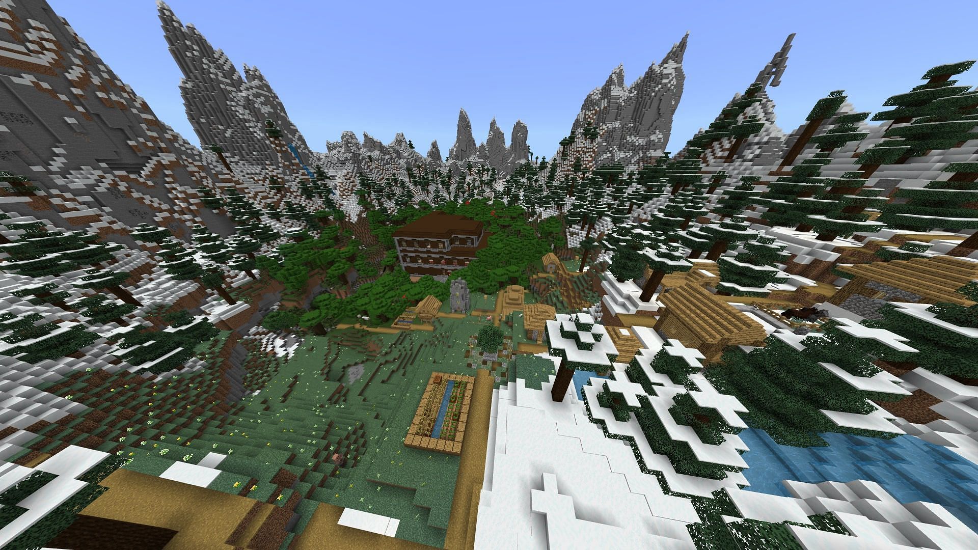 An extreme hill biome with a plains village and woodland mansion in sight (Image via Mojang)