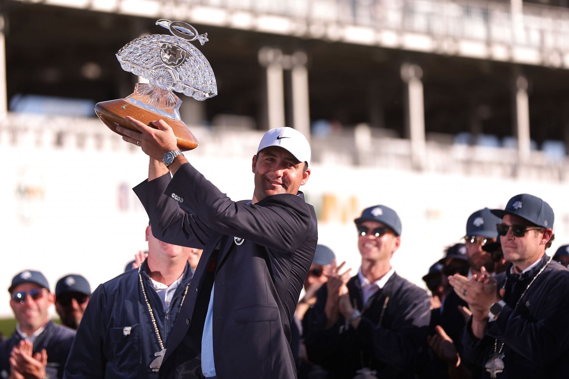 Scottie Scheffler of the United States celebrates with the trophy during the trophy ceremony after the final round of the WM Phoenix Open (Image via Getty)