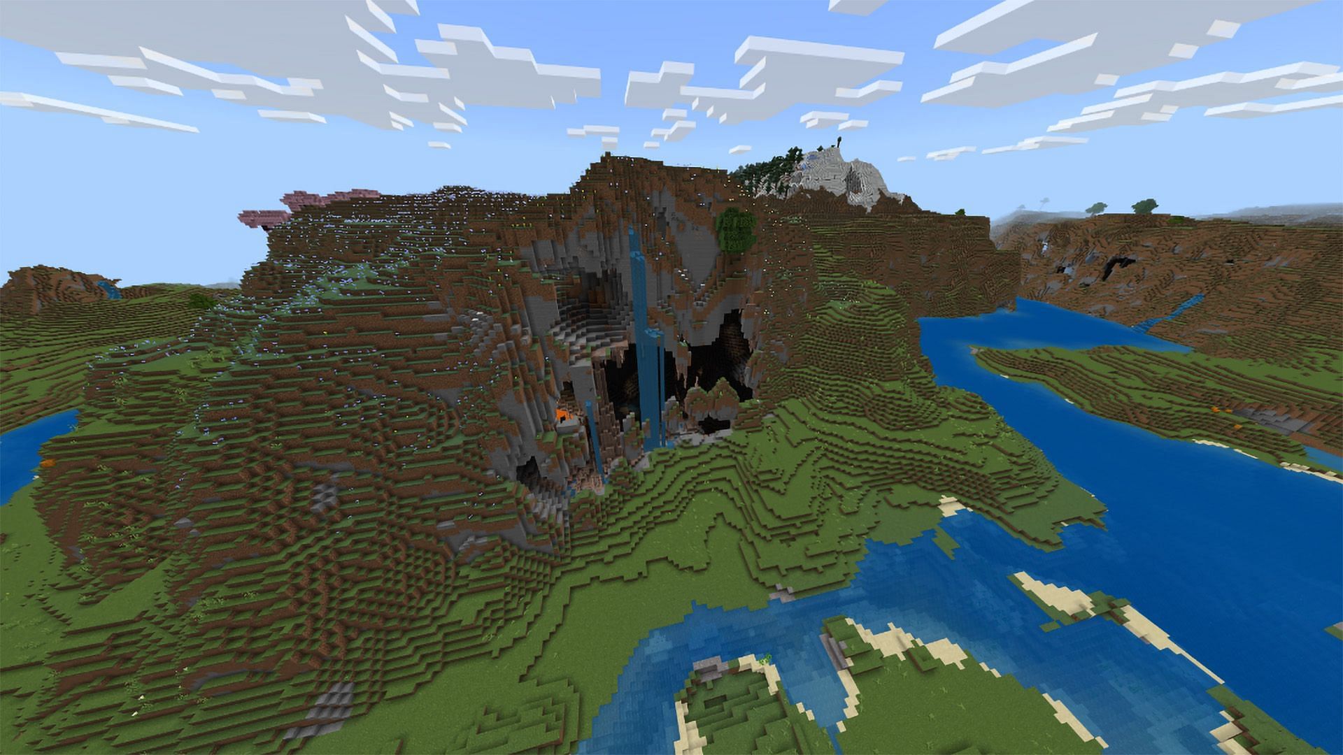 Explore this gargantuan cave, resembling a monstrous skull in Minecraft (Image via Mojang)