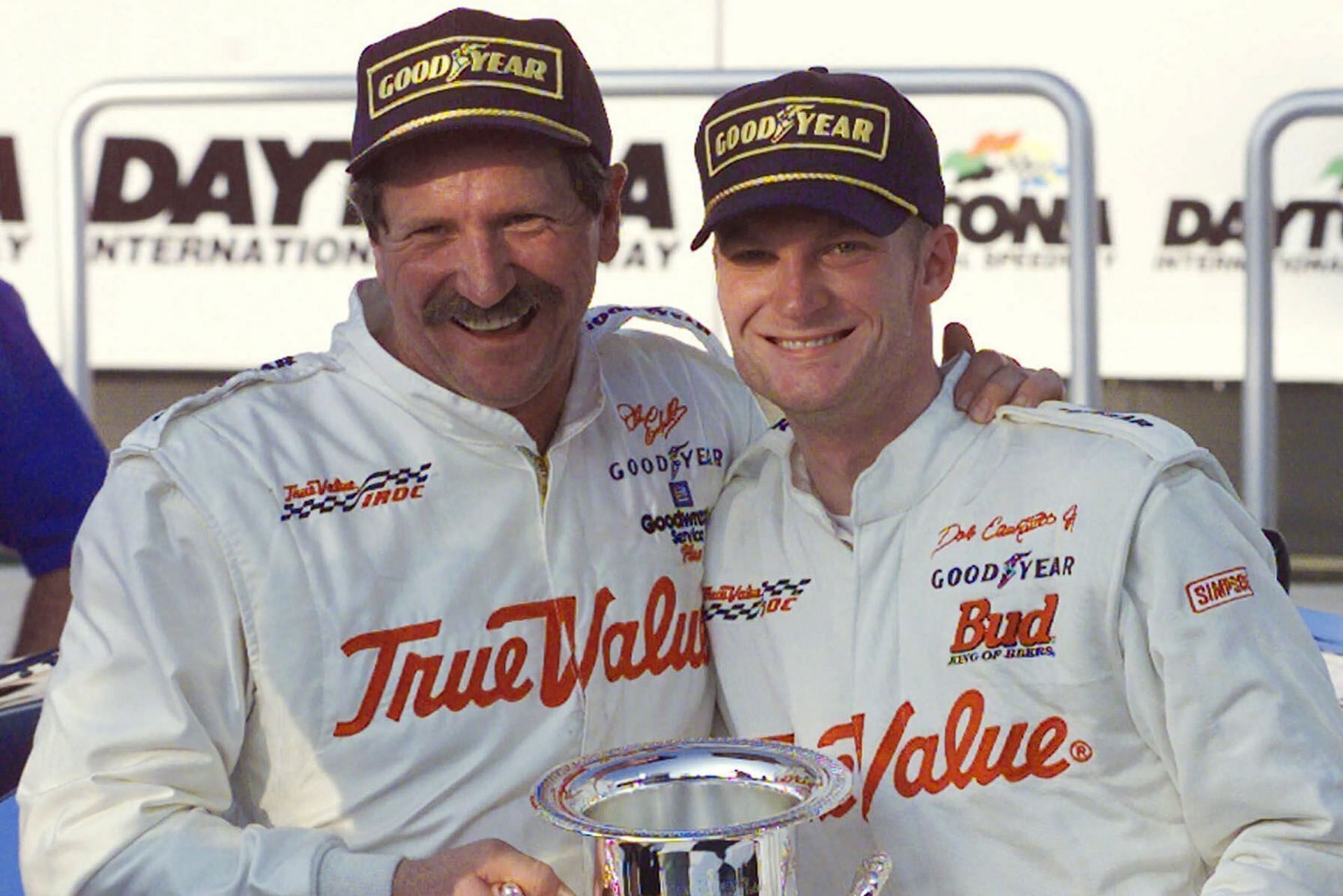 Dale Earnhardt (L) hugs Dale Earnhardt Jr. in Victory Lane on Friday afternoon, Feb. 18, 2000, after the elder Earnhardt won the International Race of Champions round at the Daytona International Speedway in Daytona Beach, Fla. The younger Earnhardt finished fifth. As he prepares to join his late father in the NASCAR Hall of Fame, Dale Earnhardt Jr. can